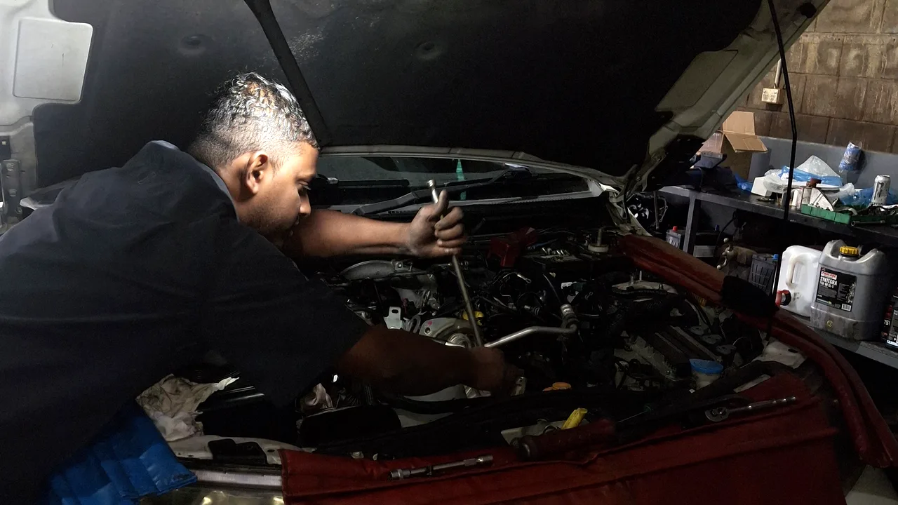 A Northside 4x4 technician servicing a ute engine