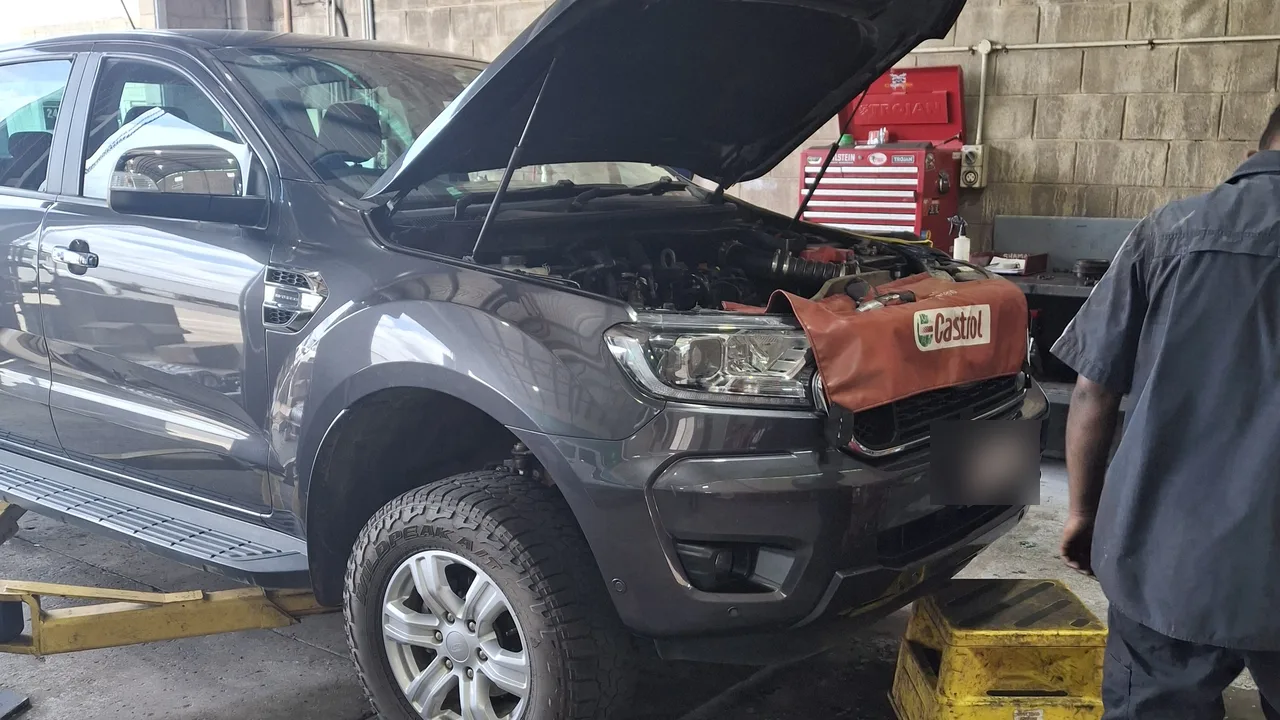 A Ford Ranger in the Northside 4x4 workshop with the bonnet up